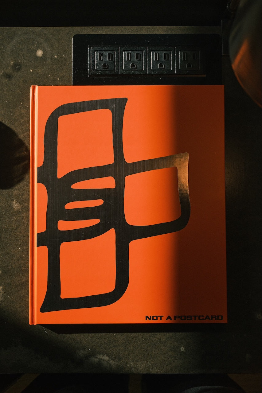 Not a Postcard - Hard cover book.